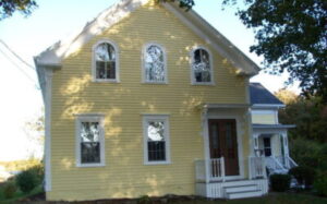 Two story house with yellow coating