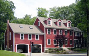 Two story house with red exterior coating